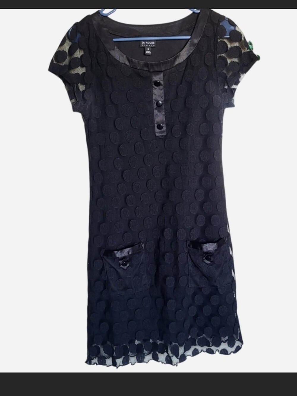 Black polka dot dress with mesh overlay and front pocket
